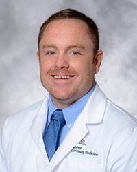 Dr. Travis                Hughes